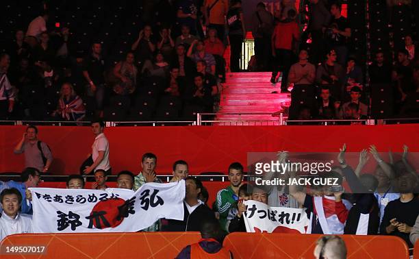 Contingent of Japanese fans cheer the victory of fellow countryman Yasuhiro Suzuki over Mehdi Khalsi of Morocco in their first round Welterweight...