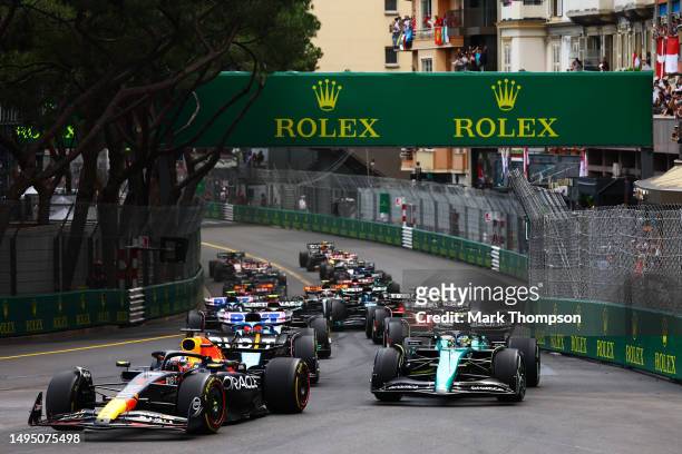Max Verstappen of the Netherlands driving the Oracle Red Bull Racing RB19 leads Fernando Alonso of Spain driving the Aston Martin AMR23 Mercedes and...