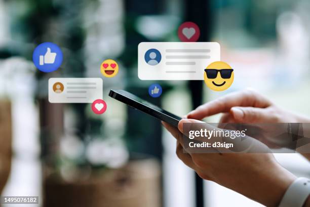 close up of young woman using smartphone on social media network application. viewing posts, giving likes or love, making friends on social media pages in the city. people engaging in networking with technology. social media addiction concept - problem bildbanksfoton och bilder