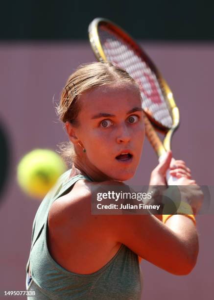 Karolina Anna Schmiedlova of Slovakia plays a backhand against Aliona Bolsova of Spain during the Women's Singles Second Round match on Day Five of...