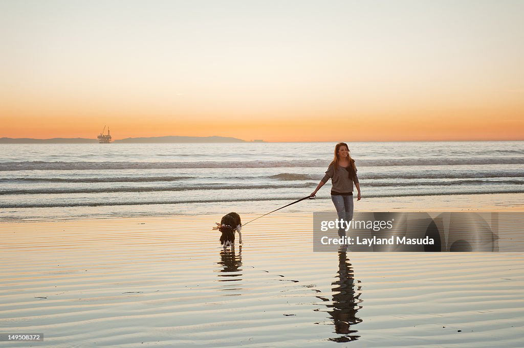 Walking with dog at dog beach