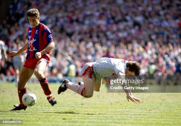Palace defender John Pemberton challenges Peter Beardsley of Liverpool during an FA Cup semi final between Crystal Palace and Liverpool at Sehurst...