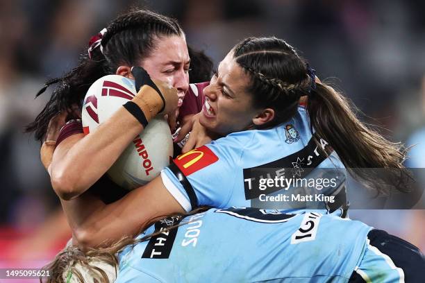 Romy Teitzel of the Maroons is tackled by Shaylee Bent of the Blues during game one of the Women's State of Origin series between New South Wales and...