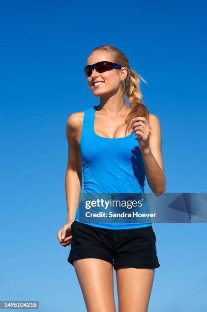 having fun jogging on cape town beach wearing sunglasses - sonnenschutz stock pictures, royalty-free photos & images