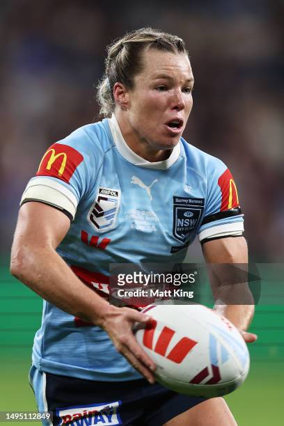 Emma Tonegato of the Blues runs with the ball during game one of the Women's State of Origin series between New South Wales and Queensland at...