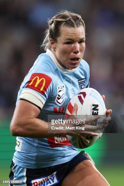 Emma Tonegato of the Blues runs with the ball during game one of the Women's State of Origin series between New South Wales and Queensland at...