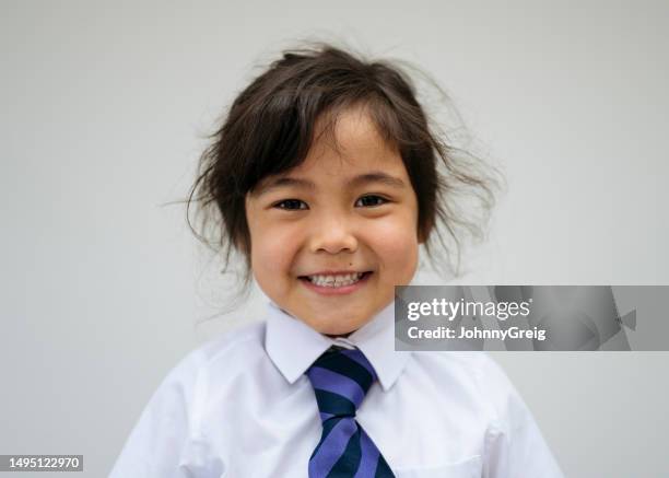 multiracial schoolgirl in white shirt and striped necktie - striped shirt stock pictures, royalty-free photos & images