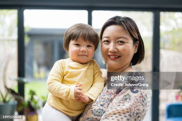 mature woman and 12-month old baby boy - korean ethnicity stock pictures, royalty-free photos & images