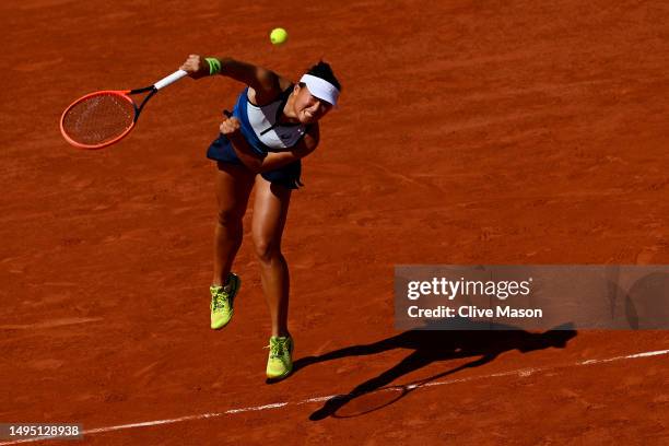 Claire Liu of United States serves against Iga Swiatek of Poland during the Women's Singles Second Round match on Day Five of the 2023 French Open at...