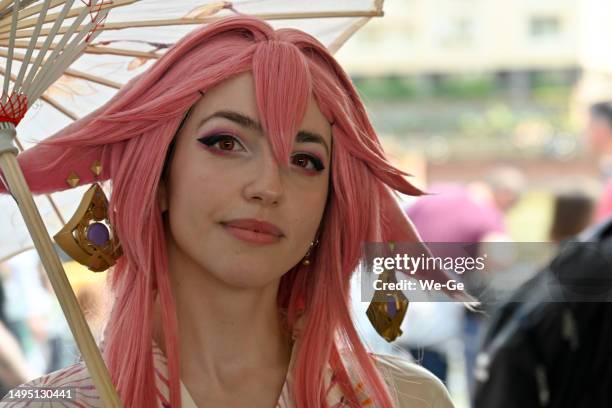 young people dress up at "japan day" in duesseldorf - where thousands of cosplayers gather on the lower banks of the rhine to celebrate. - anime cosplay stock pictures, royalty-free photos & images