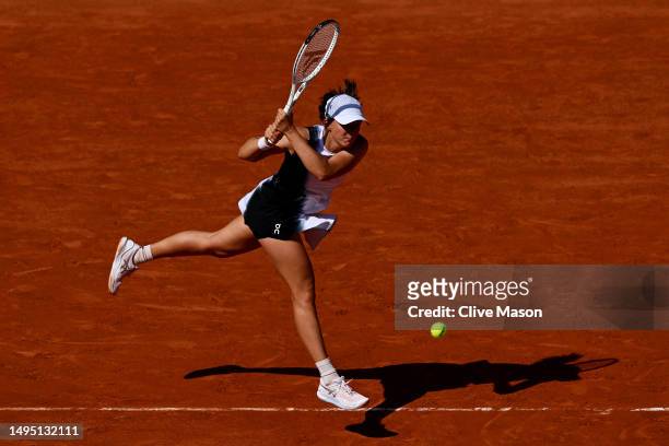 Iga Swiatek of Poland plays a backhand against Claire Liu of United States during the Women's Singles Second Round match on Day Five of the 2023...