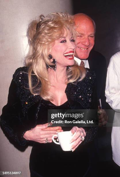 American Country musician Dolly Parton and businessman Barry Diller attend a premiere of 'Shining Through' at the Ziegfeld Theater, New York, New...