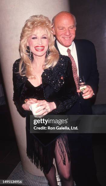 American Country musician Dolly Parton and businessman Barry Diller attend a premiere of 'Shining Through' at the Ziegfeld Theater, New York, New...