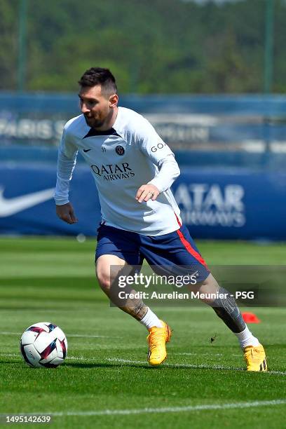 Leo Messi runs with the ball during a Paris Saint-Germain training session at Ooredoo Center on June 01, 2023 in Paris, France.