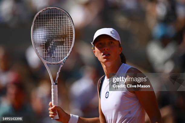 Iga Swiatek of Poland looks to the crowd after match point against Claire Liu of United States during the Women's Singles Second Round match on Day...