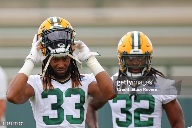 Aaron Jones and Lew Nichols of the Green Bay Packers participate in an OTA practice session at Don Hutson Center on May 31, 2023 in Ashwaubenon,...