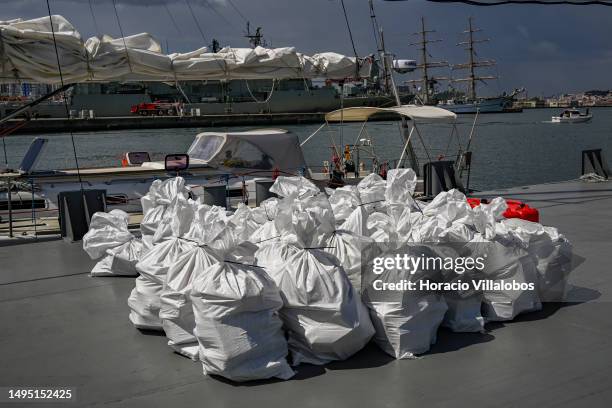 Sacks containing cocaine packages are seen in front of the aprehended sailboat in the Lisbon Navy Base on "Operação Mónaco" to combat drug...