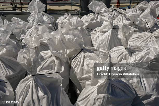 Sacks containing cocaine packages are seen in front of the aprehended sailboat in the Lisbon Navy Base on "Operação Mónaco" to combat drug...