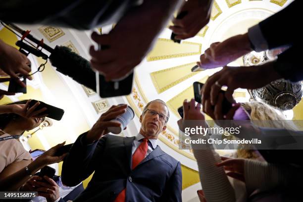 Senate Minority Whip John Thune is surrounded by reporters following a meeting in Senate Minority Leader Mitch McConnell's office at the U.S. Capitol...