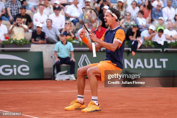 Daniel Altmaier of Germany celebrates winning match point against Jannik Sinner of Italy during the Men's Singles Second Round match on Day Five of...