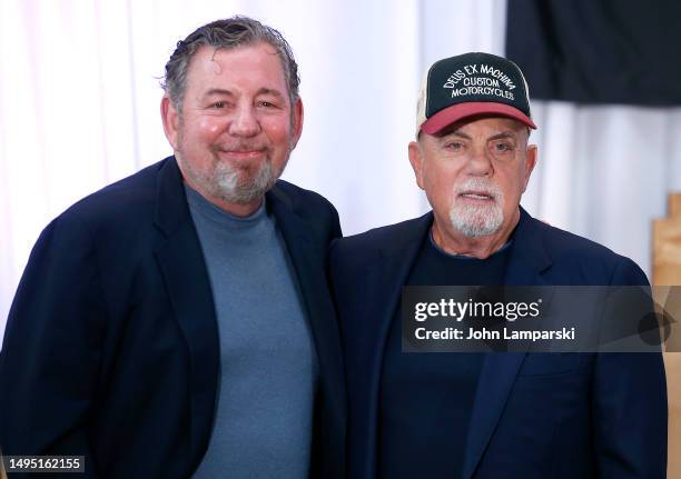 Billy Joel listens as James Dolan speaks as MSG Entertainment and Billy Joel make a special franchise announcement at Chase Square at Madison Square...