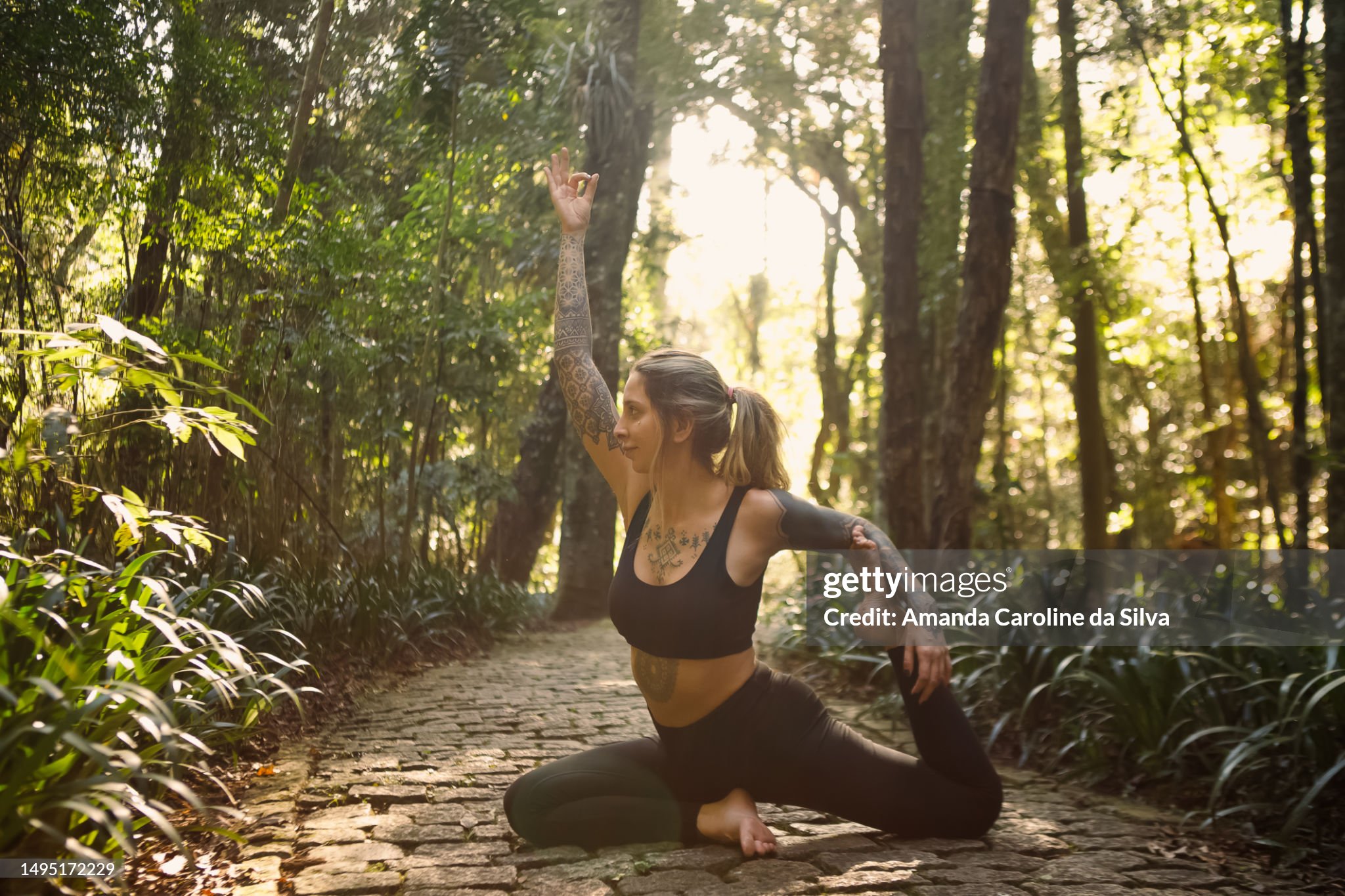 https://media.gettyimages.com/id/1495172229/photo/portrait-of-tattooed-brazilian-young-woman-in-yoga-posture-in-a-forest.jpg?s=2048x2048&w=gi&k=20&c=EApgQhBJZloUzIBq0GeAiv6xQclDx0E--MrZnNMW2L8=