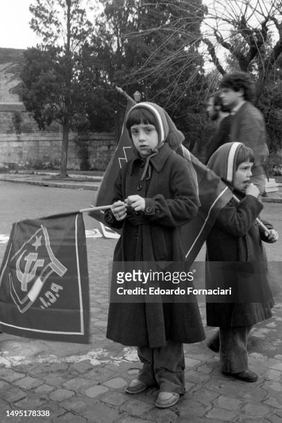 View of two young girls as they hold Partito Comunista Italiano flags on Festa dei Lavoratori , Rome, Italy, May 1, 1978.