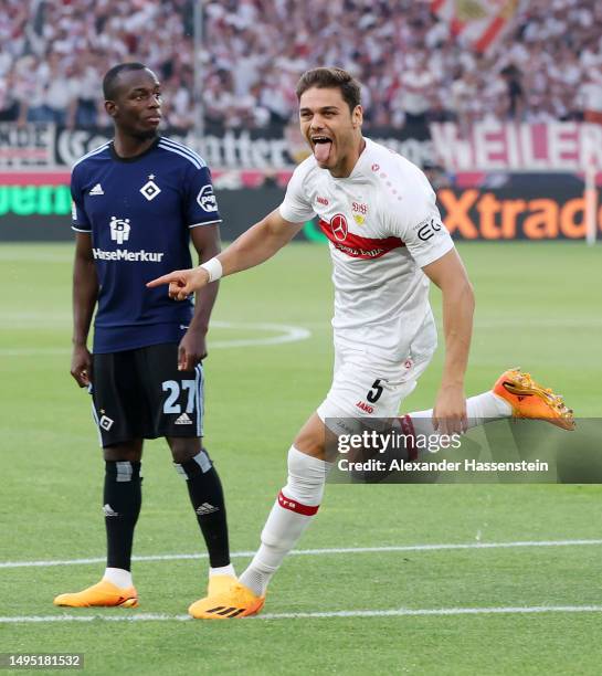 Konstantinos Mavropanos of VfB Stuttgart celebrates after scoring the team's first goal as Jean-Luc Dompe of Hamburger SV looks on on during the...