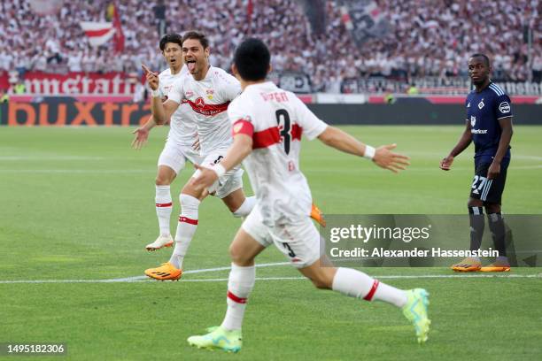 Konstantinos Mavropanos of VfB Stuttgart celebrates with teammates after scoring the team's first goal during the Bundesliga playoffs first leg match...