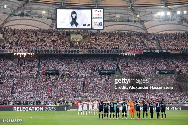 Players, match officials and fans take part in a minute's silence for a boy who died after a post-match brawl at an international youth tournament,...