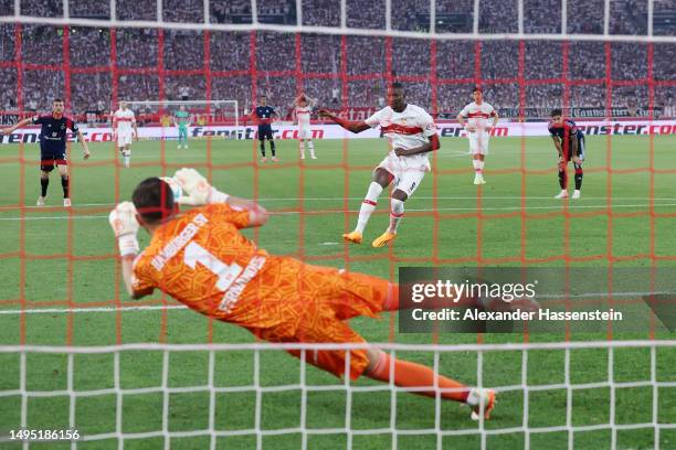 Sehrou Guirassy of VfB Stuttgart fails to score from the penalty spot as Daniel Heuer Fernandes of Hamburger SV saves during the Bundesliga playoffs...