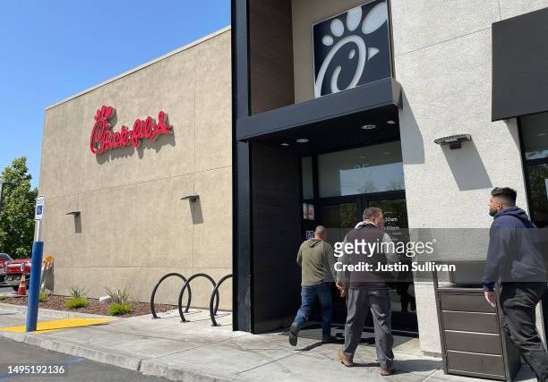 Customers enter a Chick-fil-A restaurant on June 01, 2023 in Novato, California. The fast food chain is drawing criticism on social media for its...