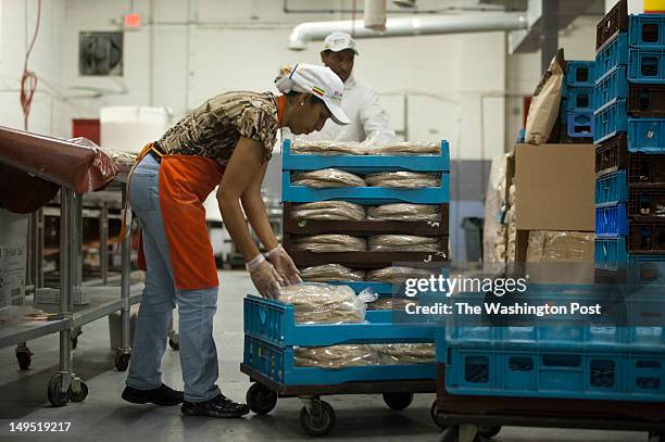 13Lemlem Maru and her brother Agegenehu Maru work the late nightshift, packaging Injera bread fresh off the conveyor belt in a factory in Northeast...