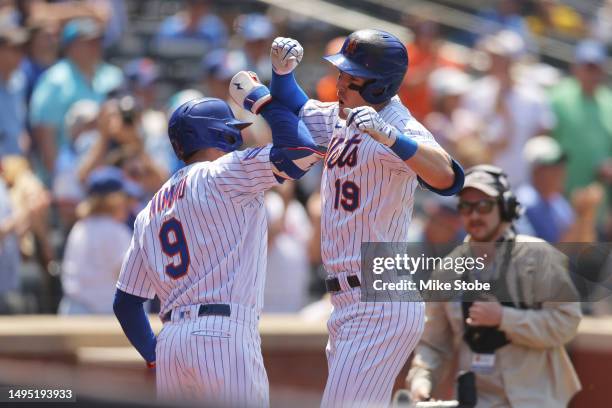 Mark Canha of the New York Mets celebrates with Brandon Nimmo after hitting a two-run home run against the Philadelphia Phillies in the fourth inning...