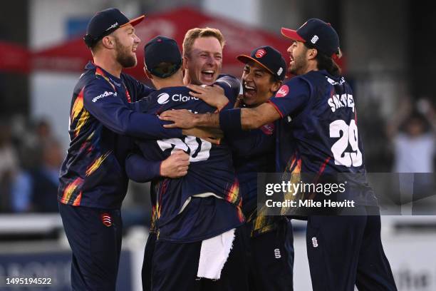 Simon Harmer of Essex celebrates with team mates after completing his hat trick by dismissing Michael Burgess of Sussex during the Vitality Blast T20...