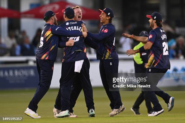 Simon Harmer of Essex celebrates with team mates after completing his hat trick by dismissing Michael Burgess of Sussex during the Vitality Blast T20...
