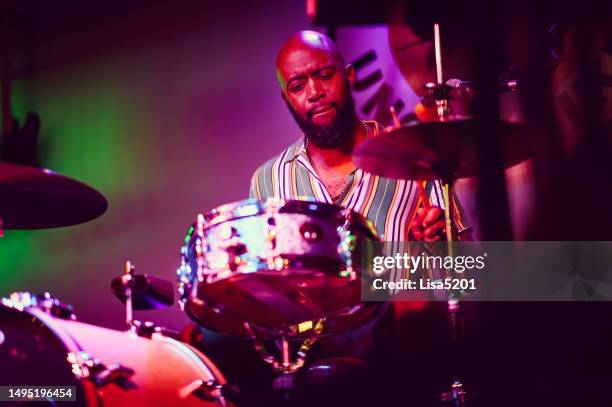 drummer musician performing on stage - drummer stock pictures, royalty-free photos & images