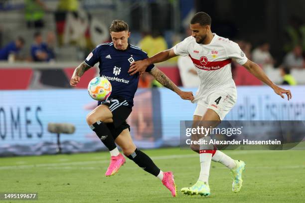 Sonny Kittel of Hamburger SV battles for possession with Josha Vagnoman of VfB Stuttgart during the Bundesliga playoffs first leg match between VfB...