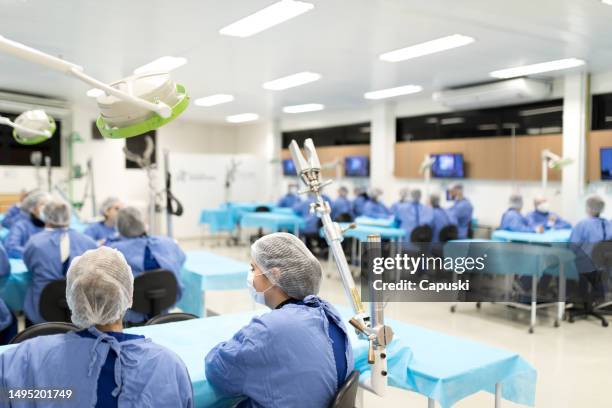 medicine students in a practical classroom - cirurgia stock pictures, royalty-free photos & images