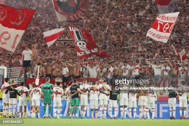 Players of VfB Stuttgart celebrate with the fans following the team's victory in the Bundesliga playoffs first leg match between VfB Stuttgart and...