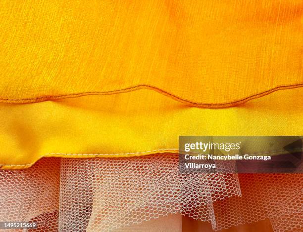 bright orange-coloured layered sheer fabric - hem stock pictures, royalty-free photos & images