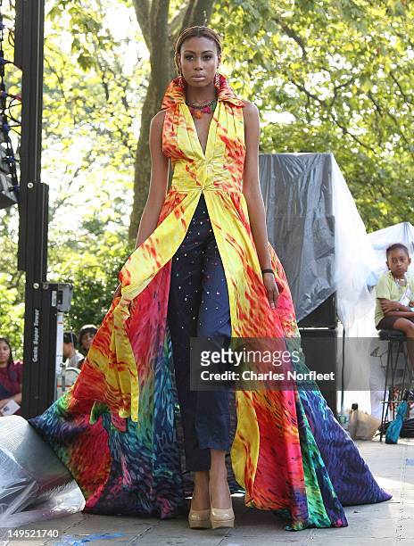 Model walks the stage in a Hope Wade original design at Harlem Week's 38th Anniversary Celebration at Ulysses S. Grant National Memorial Park on July...