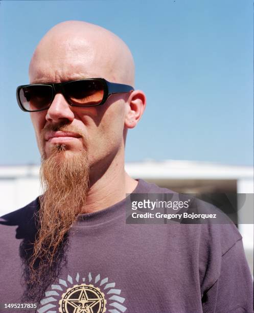 Musician Nick Oliveri of the rock group Queens of the Stone Age pose for a photo at Van Nuys Airport in September, 2002 in Van Nuys, California.