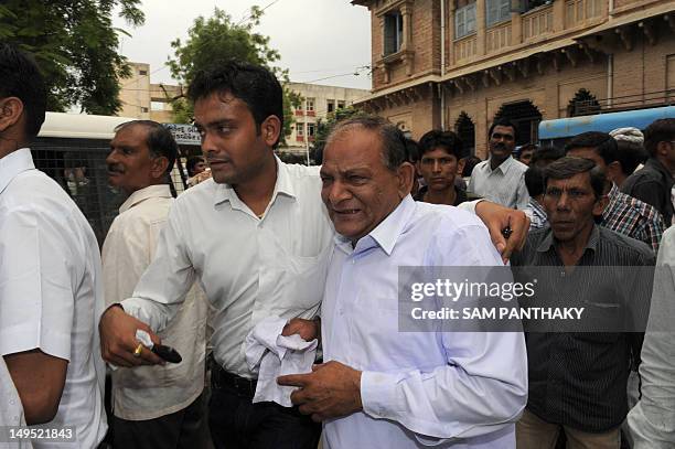 Relative of one of the convicted reacts outside the court in Mehsana, some 70 kms from Ahmedabad on July 30, 2012. The court convicted 22 accused in...