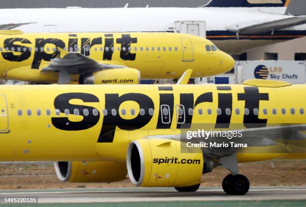 Spirit Airlines plane taxis near another Spirit aircraft at Los Angeles International Airport on June 1, 2023 in Los Angeles, California. Over 40...