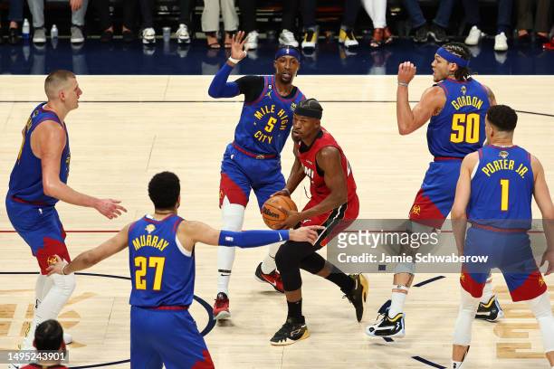 Jimmy Butler of the Miami Heat drives to the basket during the first quarter against the Denver Nuggets in Game One of the 2023 NBA Finals at Ball...