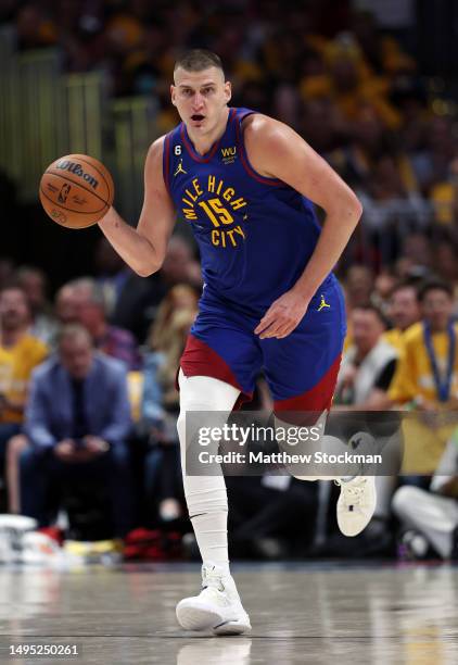 Nikola Jokic of the Denver Nuggets dribbles the ball during the second quarter against the Miami Heat in Game One of the 2023 NBA Finals at Ball...