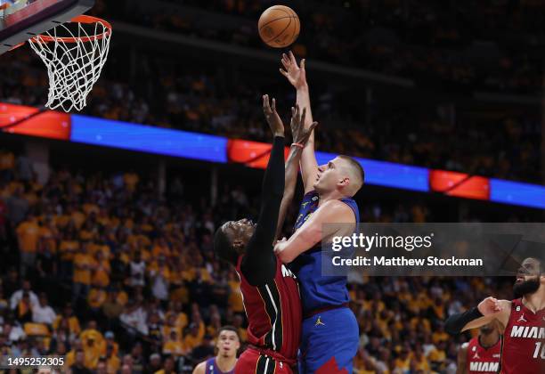 Nikola Jokic of the Denver Nuggets shoots over Bam Adebayo of the Miami Heat during the second quarter in Game One of the 2023 NBA Finals at Ball...