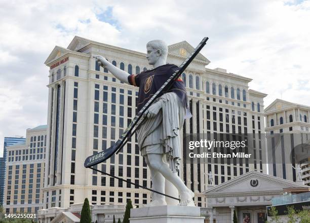 Statue of Julius Caesar in front of Caesars Palace on the Las Vegas Strip wears a Vegas Golden Knights jersey and displays an oversized hockey stick...