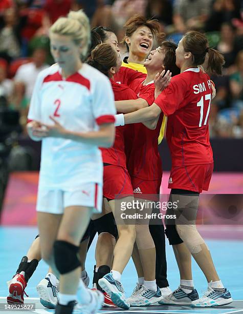 Korea celebrate beating Denmark 25-24 during the Women's Handball Preliminaries Group B - Match 8 between Korea and Denmark on Day 3 of the London...